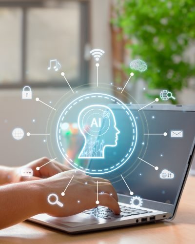 Vertical Image on Using of a laptop to interact with an artificial intelligence.